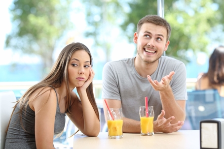 women bored of husband at breakfast