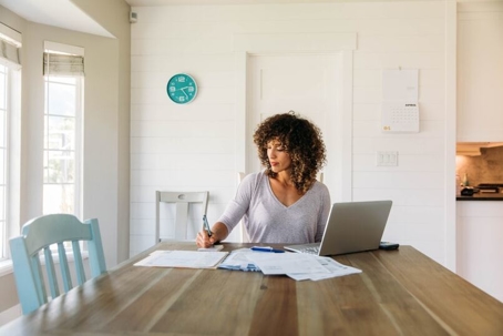 Woman looking at financial documents