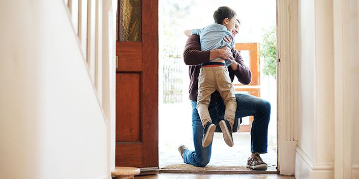 Man hugging son