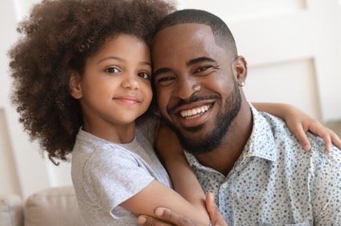 father and daughter hugging each other