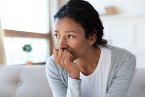 worried woman sitting and thinking